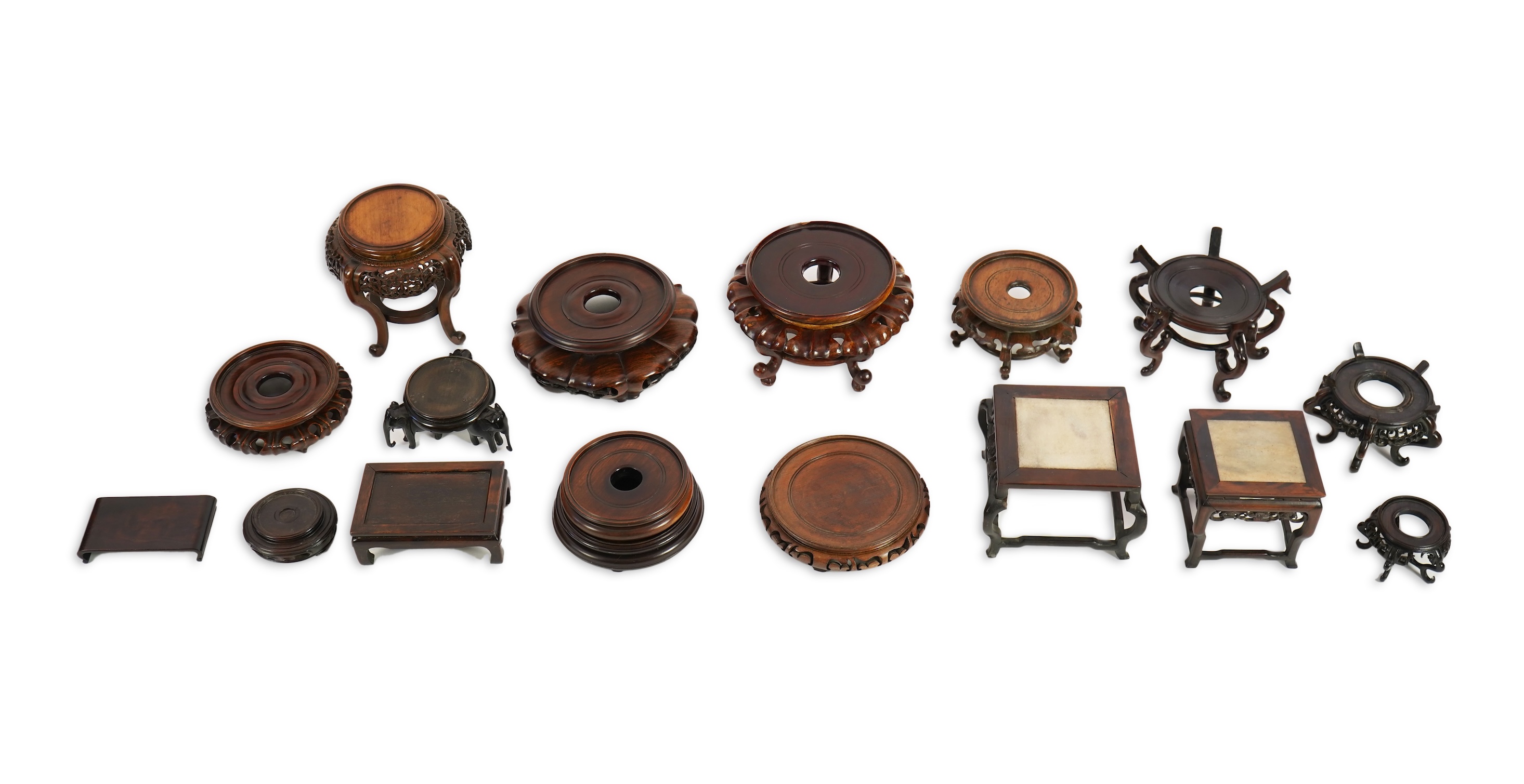 A group of sixteen Chinese hardwood stands together with a Japanese stand, 19th/20th century